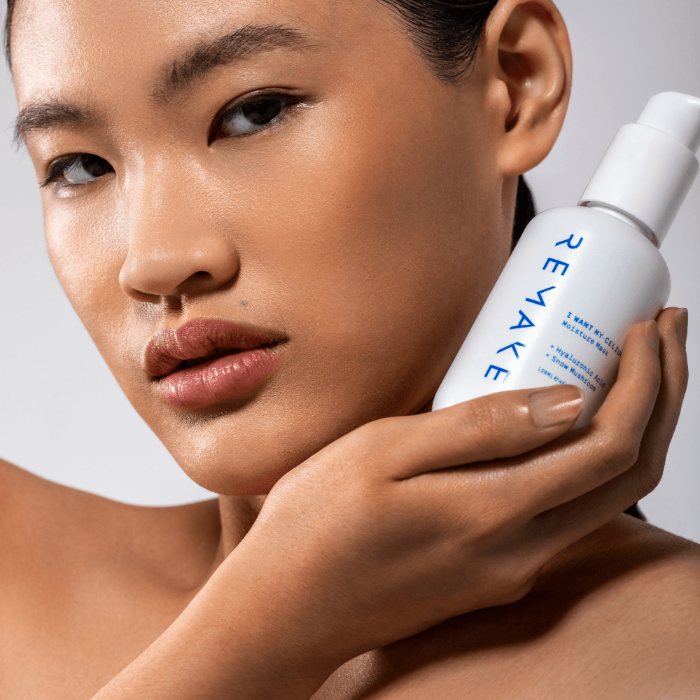 Model holding snow mushroom in hand, natural skincare ingredient used in REMAKE My-Celium Moisture Mask for hydration