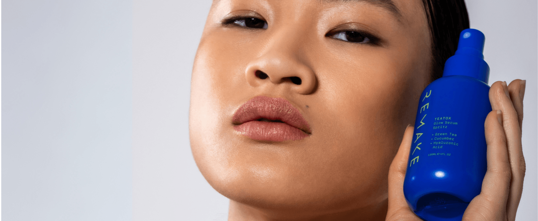 Close up of model holding REMAKE TeaTox Flow Serum Mist, natural hydrating Australian clean beauty skincare