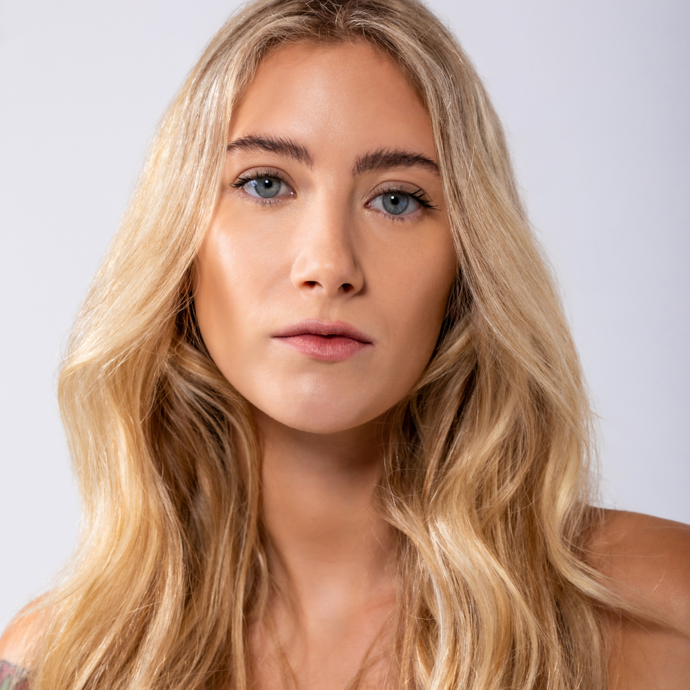 Model with glowing radiant skin showcasing REMAKE natural Australian skincare and sustainable clean beauty brand